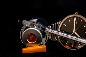 insulin syringe and watch