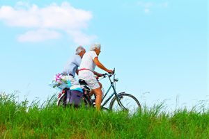 elderly couple with bicycles